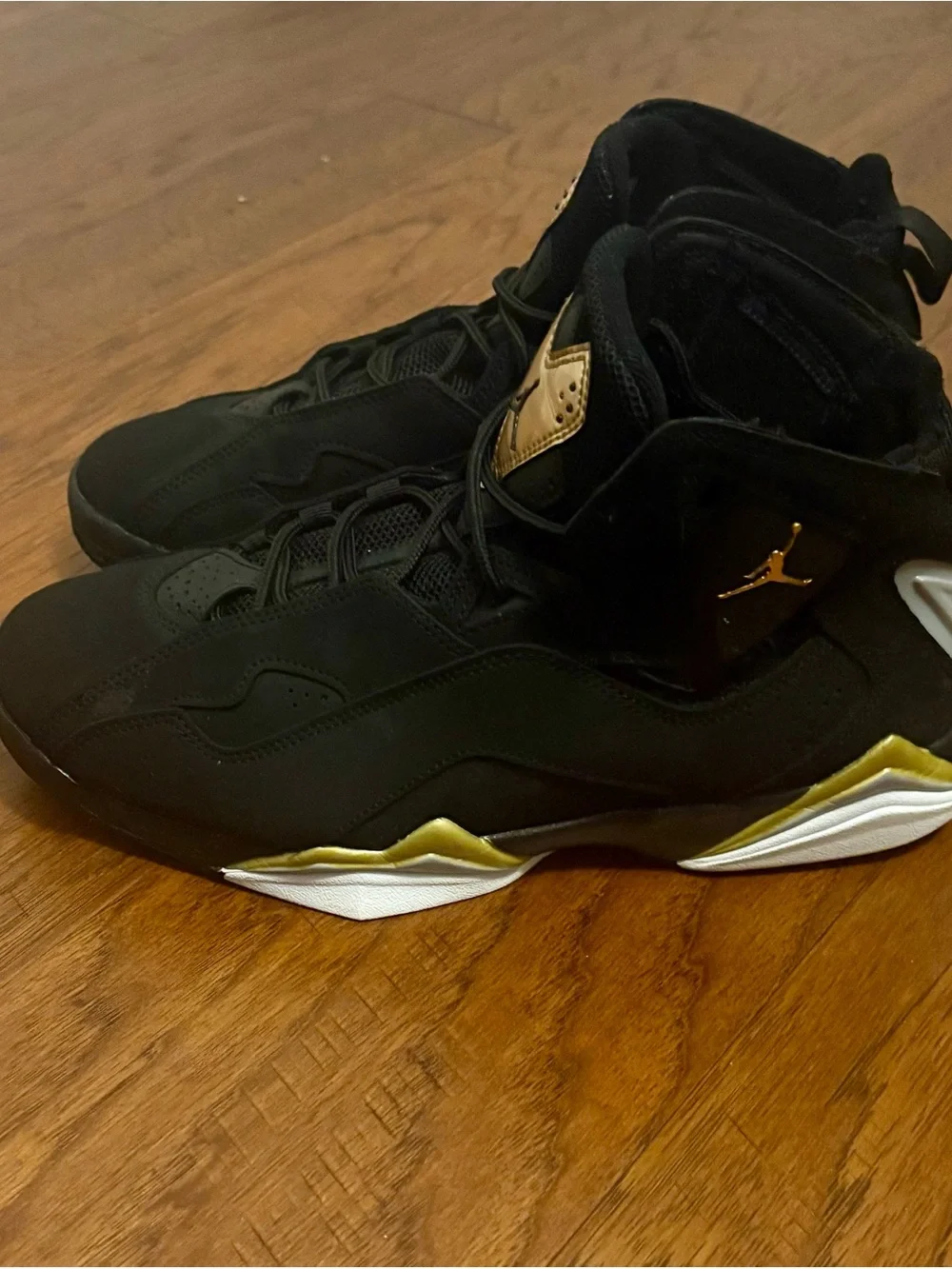 Jordan Black Basketball Sneakers with Gold Tongue Accents